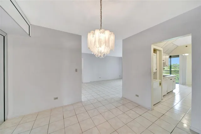 an aerial view of a tennis ground with large trees