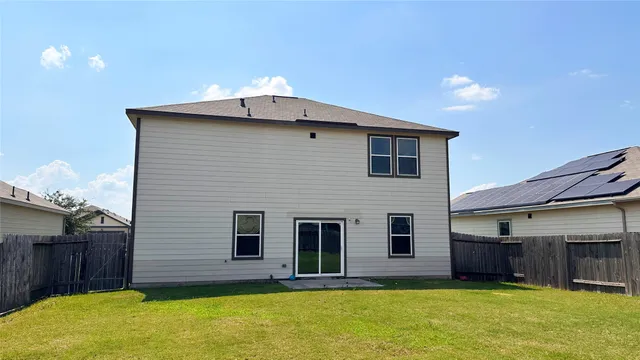 a house view with a backyard space
