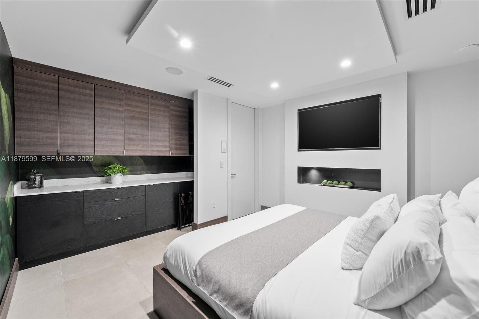280 Northeast 156th Street Miami, FL 33162 - Photo 24 of 37 a bedroom with a bed and a flat screen tv