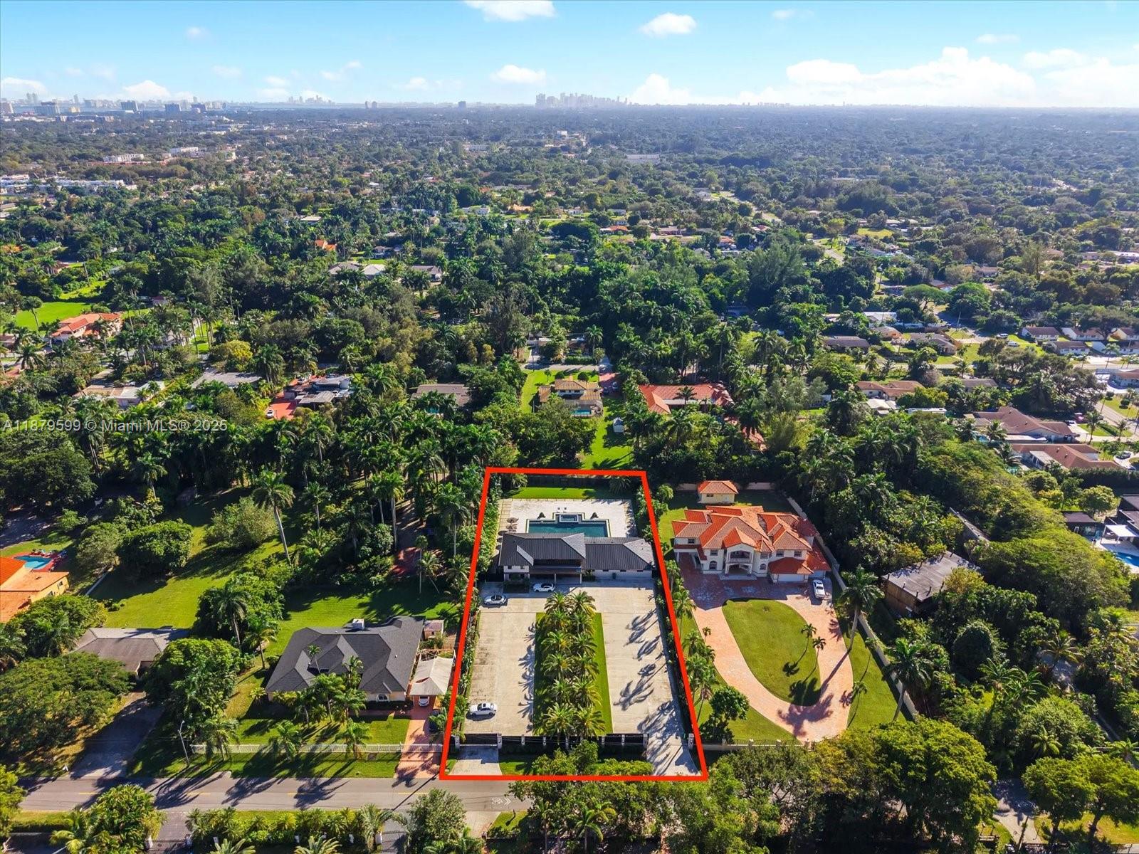 280 Northeast 156th Street Miami, FL 33162 - Photo 3 of 37 an aerial view of residential houses with outdoor space and trees