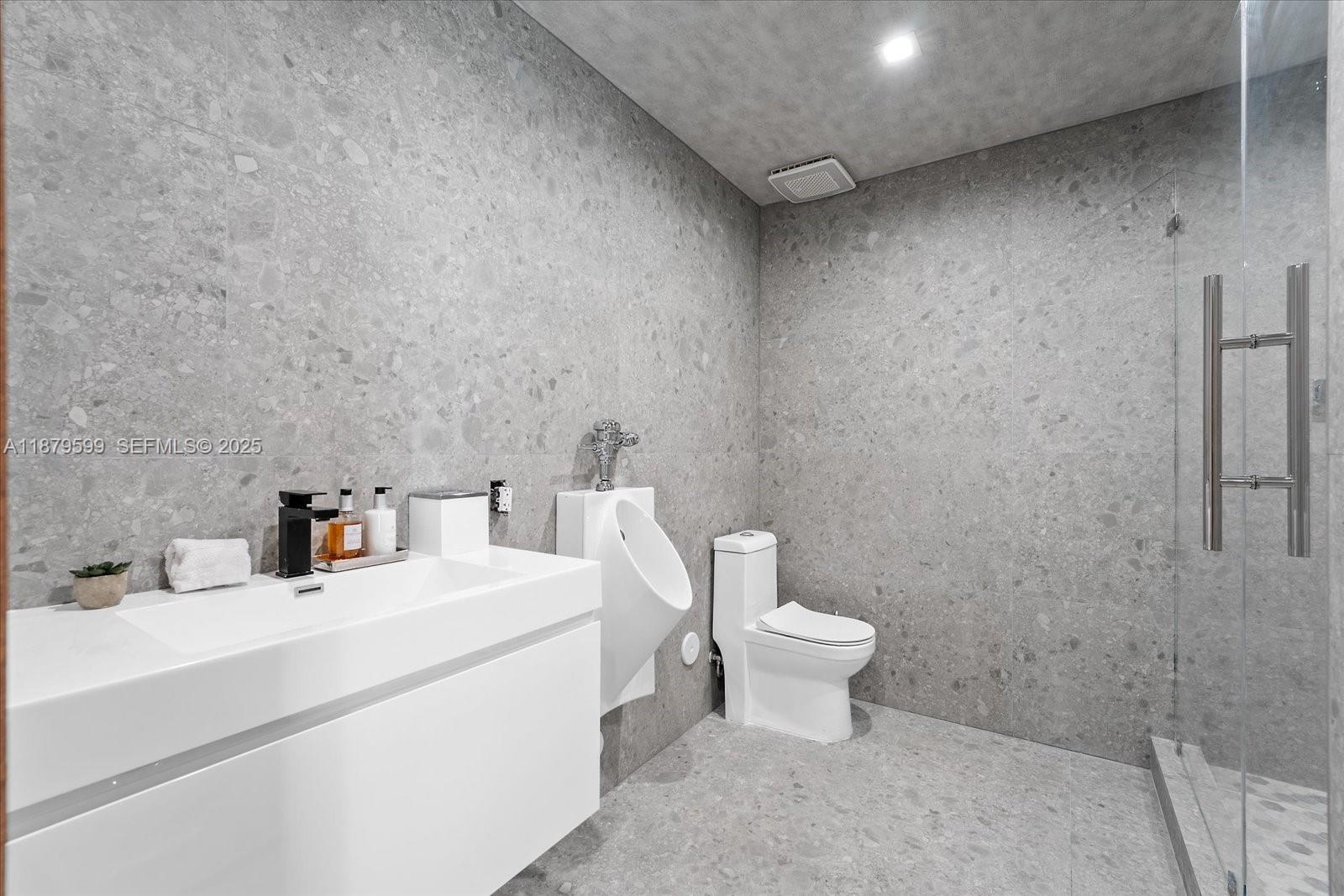 280 Northeast 156th Street Miami, FL 33162 - Photo 32 of 37 a bathroom with a sink and a toilet