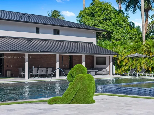 a view of a swimming pool with a lounge chair