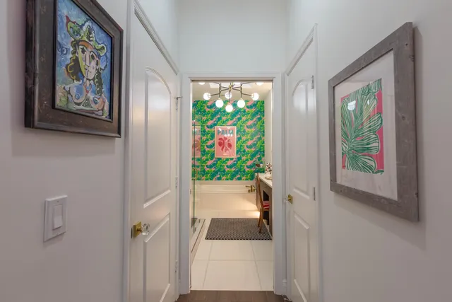 a bathroom with a sink mirror and vanity