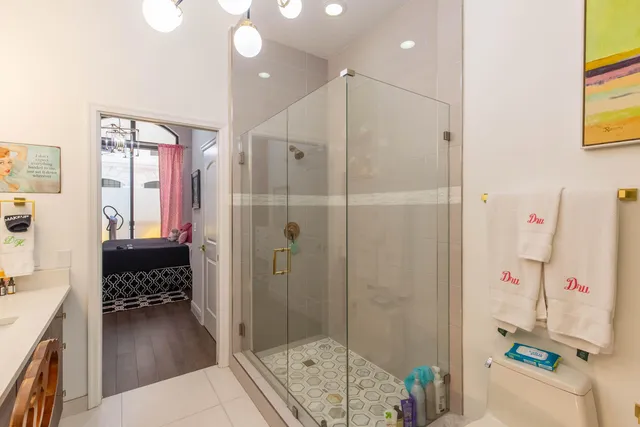 a view of walk in closet with clothes