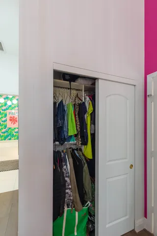 a bedroom with a bed dresser and a window