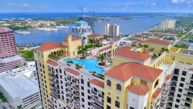 a kitchen that has a lot of cabinets and wooden floor