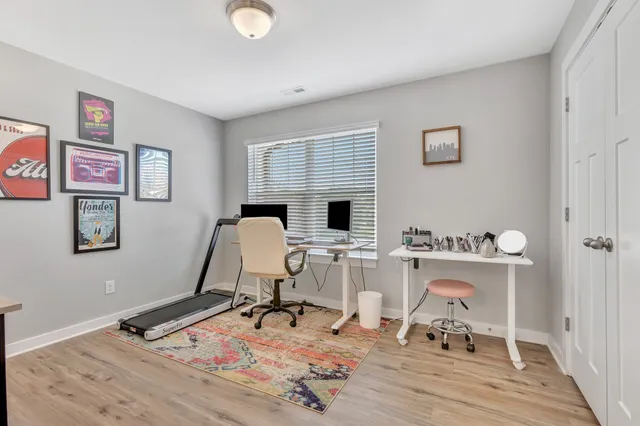 a work room with furniture and wooden floor