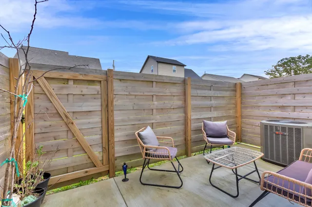 a couple of chairs sitting in front of a house