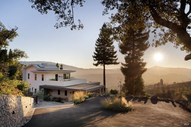 a view of house with a snow in the background