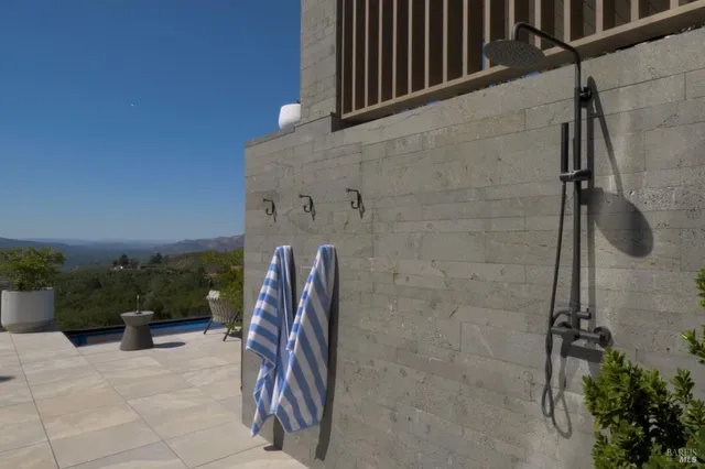 a terrace with outdoor seating and city view