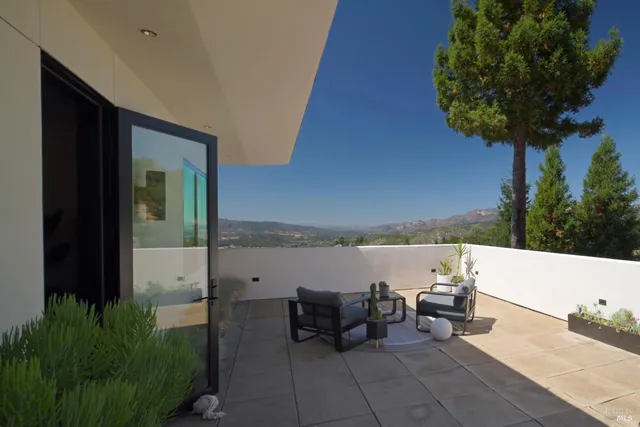 a living room with furniture fireplace and flat screen tv