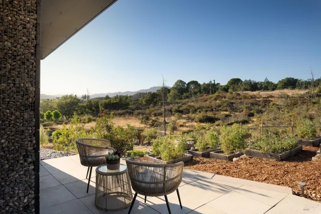 a view of a terrace with sitting area