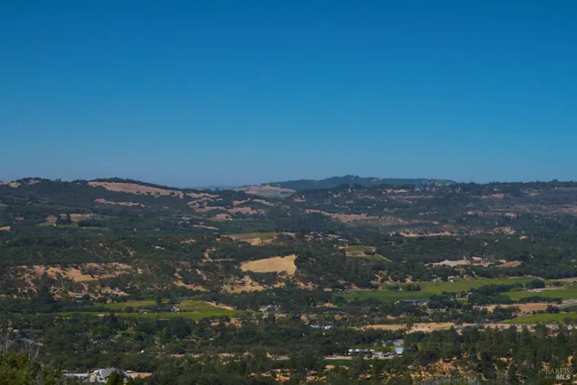 a outdoor living space with furniture and city view