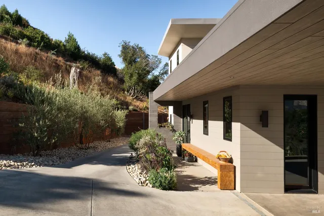 a view of living room with furniture and a large window