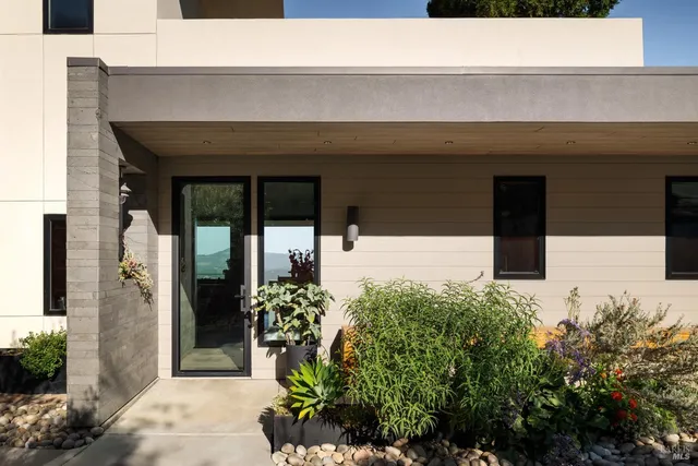 a kitchen with table chairs cabinets and wooden floor