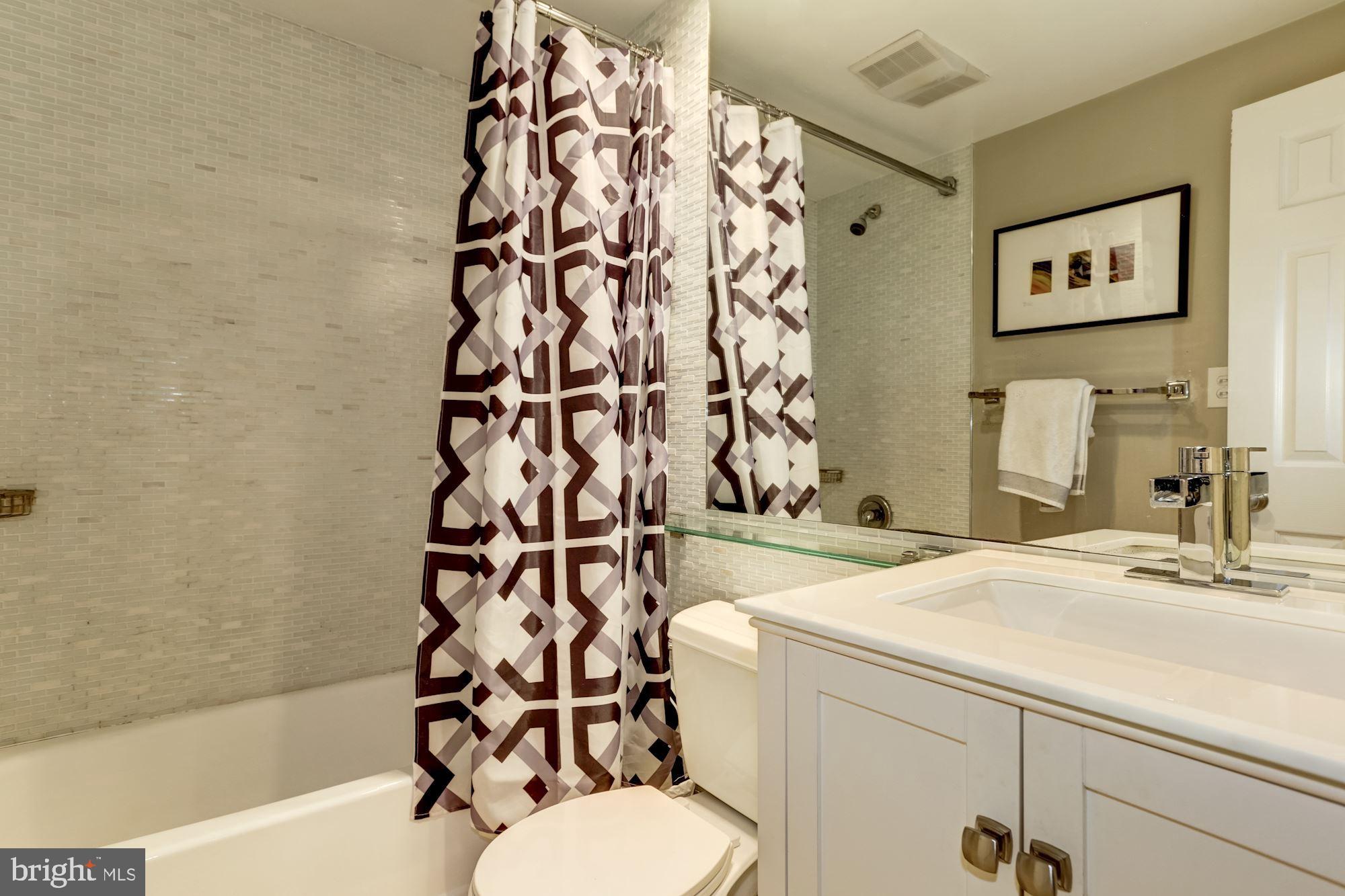 1630 19th Street Northwest, Unit B2 Washington, DC 20009 - Photo 10 of 19 a bathroom with a sink toilet and shower