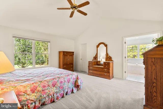 a bedroom with a bed and dresser