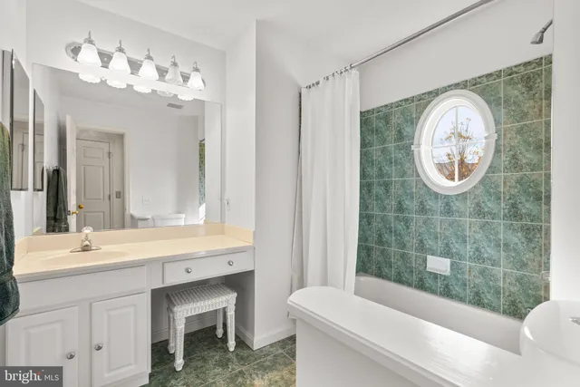 a roof deck with table and chairs and wooden floor