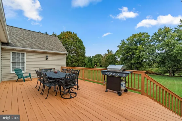 an aerial view of a house with a yard and lake view