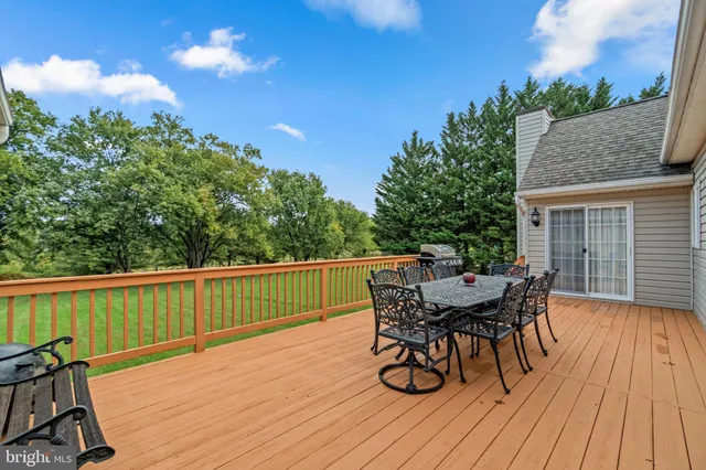 a close up of a white house with a flower garden
