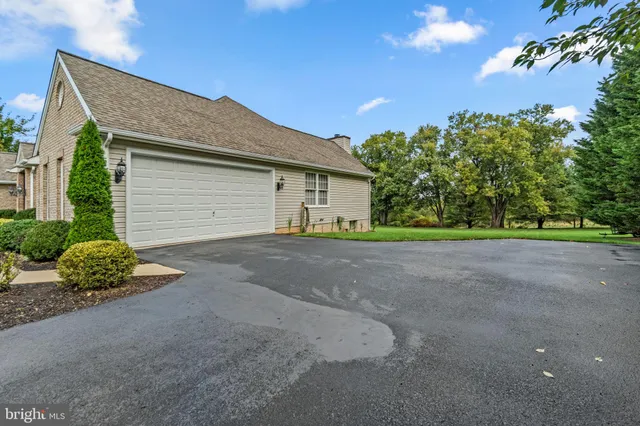 an aerial view of residential houses with outdoor space and swimming pool
