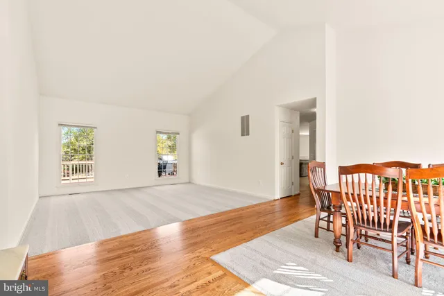 an empty room with furniture and wooden floor