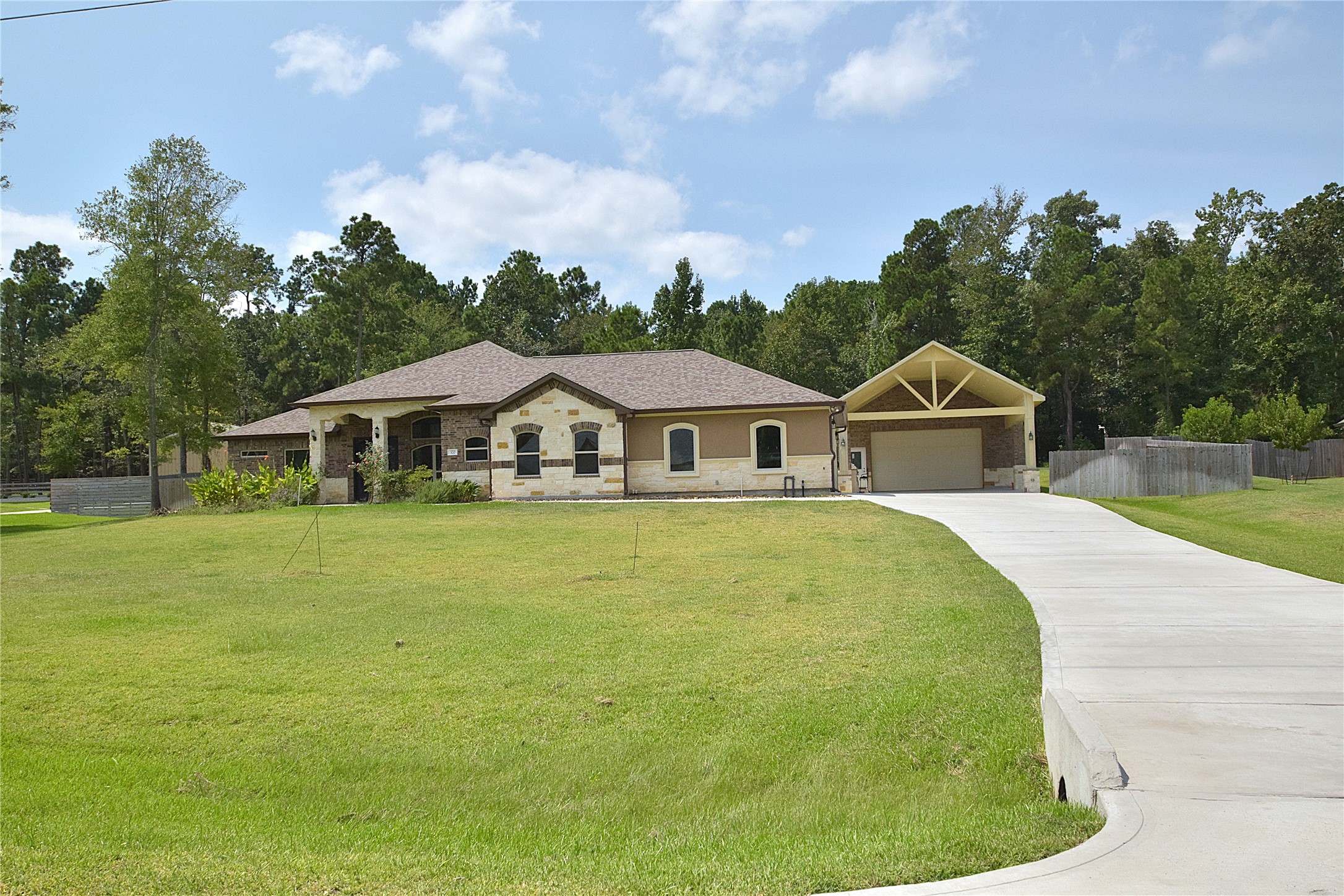 320 Dahlia Road Huntsville, TX 77320 - Photo 1 of 50 Recently built home with a new RV garage and carport.