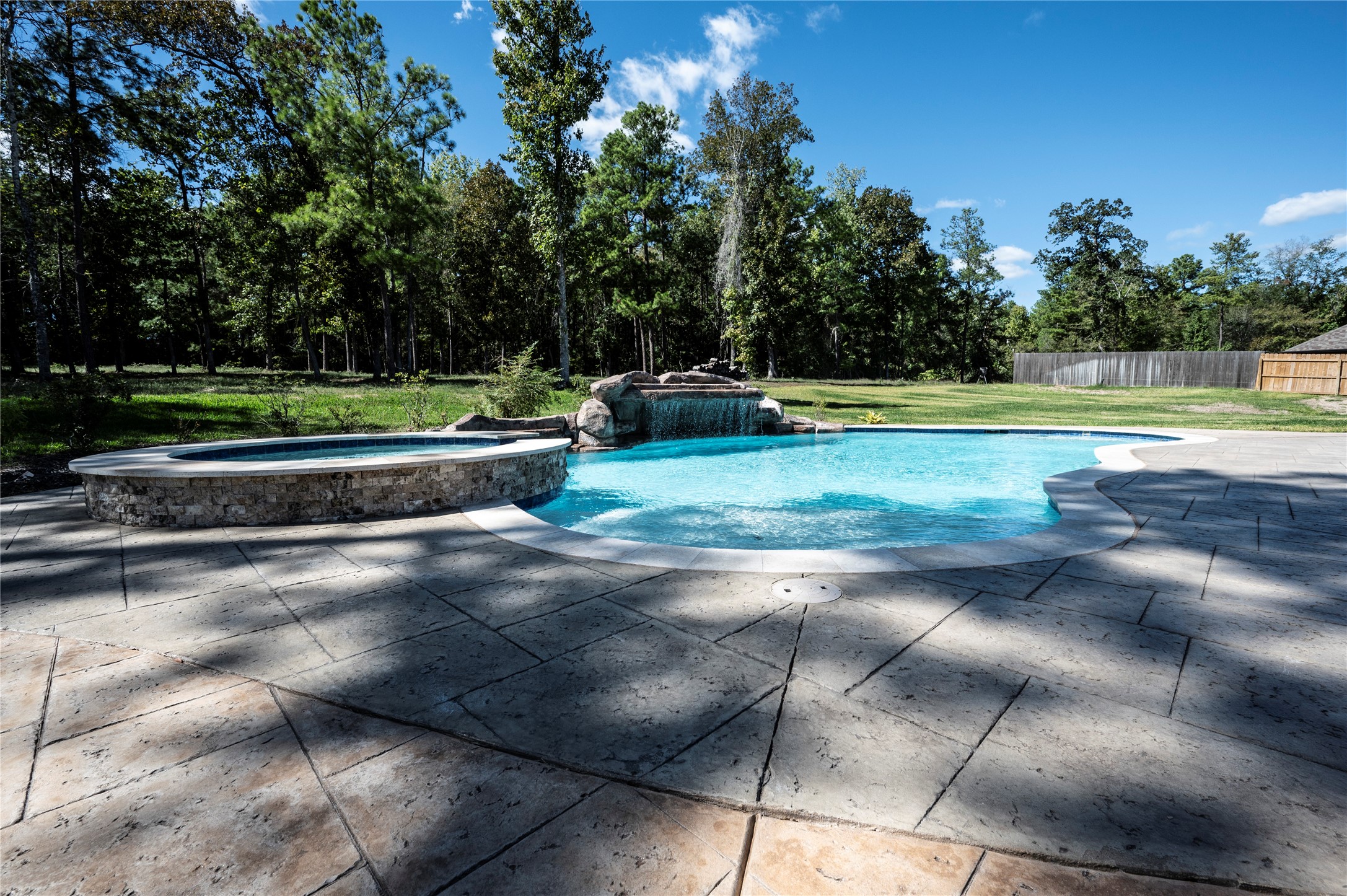 320 Dahlia Road Huntsville, TX 77320 - Photo 40 of 50 waterfall to relax on, and heated spa to soak in the good days