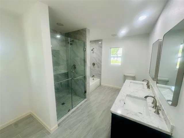 a bathroom with a sink and mirror