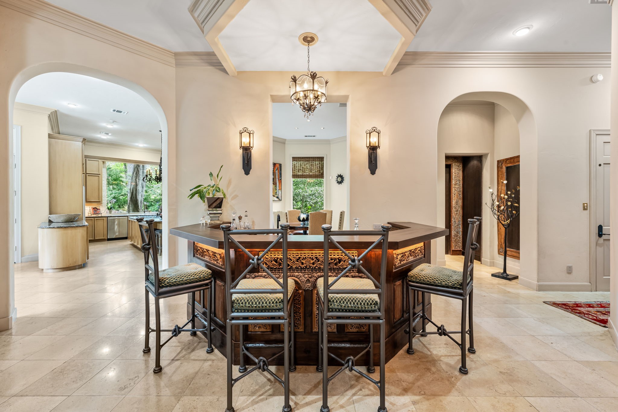 6 Mott Lane Houston, TX 77024 - Photo 26 of 50 Sophisticated entertaining space featuring a custom bar with rich wood detailing and seating.
