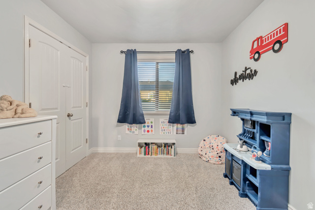 356 North 230 West Payson, UT 84651 - Photo 21 of 45 Room featuring light gray walls, gray carpet, a window with blinds and blue curtains, and white baseboards