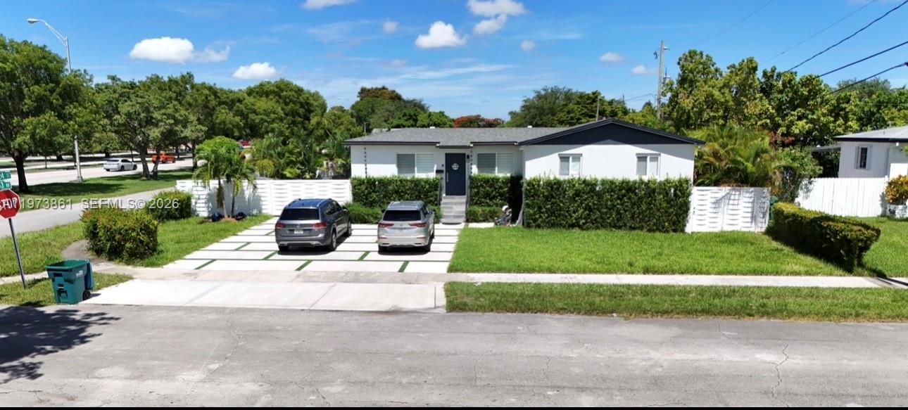 2401 Southwest 83rd Avenue Miami, FL 33155 - Photo 1 of 21 a view of a house with a yard and potted plants