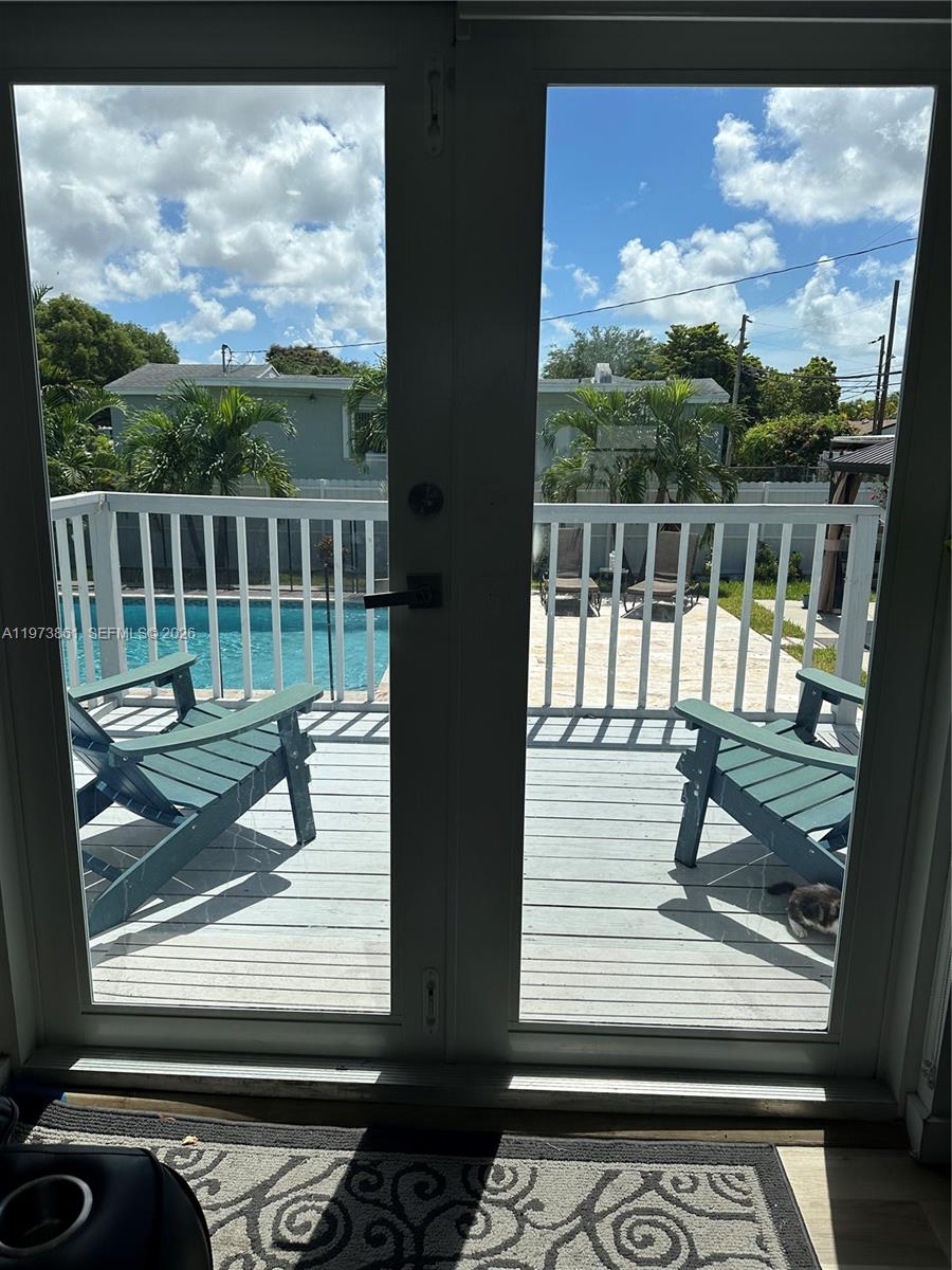 2401 Southwest 83rd Avenue Miami, FL 33155 - Photo 12 of 21 a view of a balcony with wooden floor and iron fence