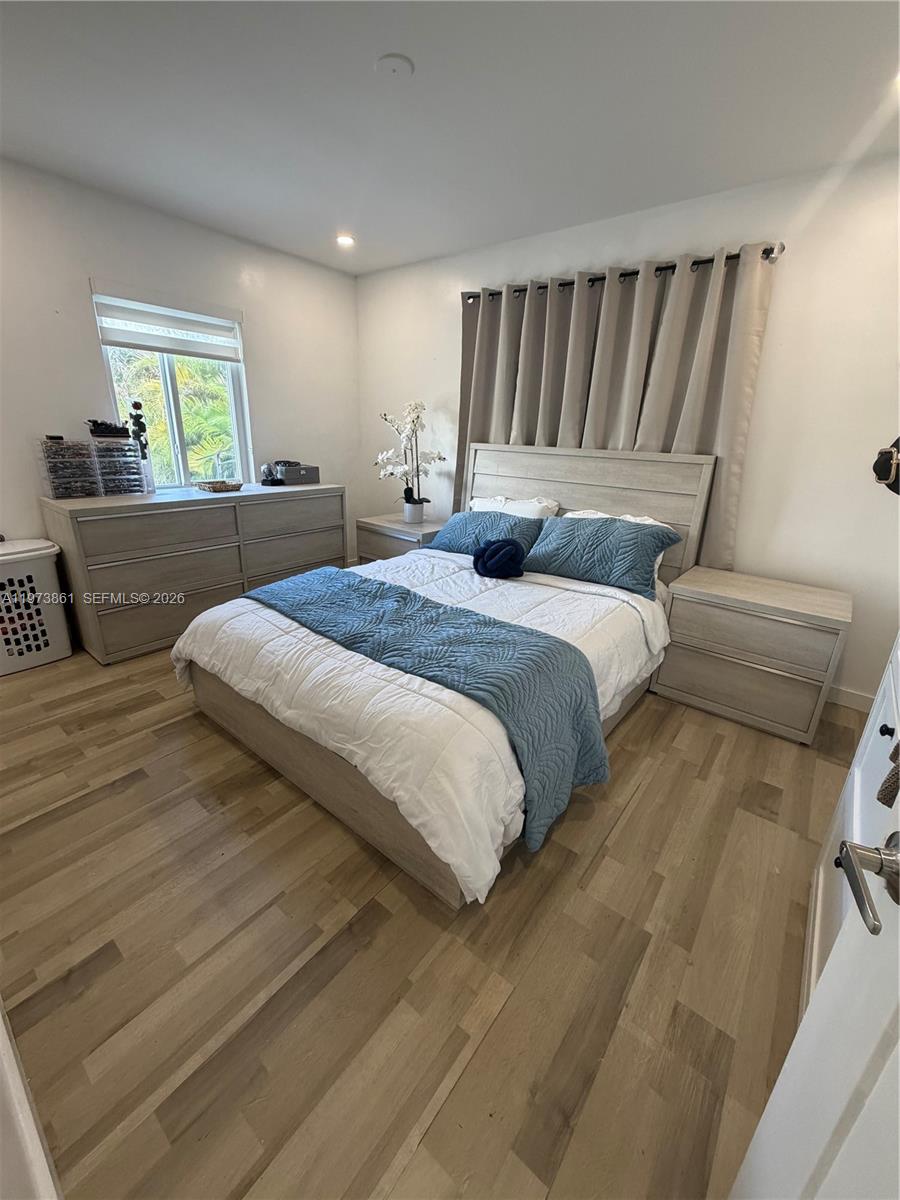 2401 Southwest 83rd Avenue Miami, FL 33155 - Photo 15 of 21 a bedroom with a large bed and a window