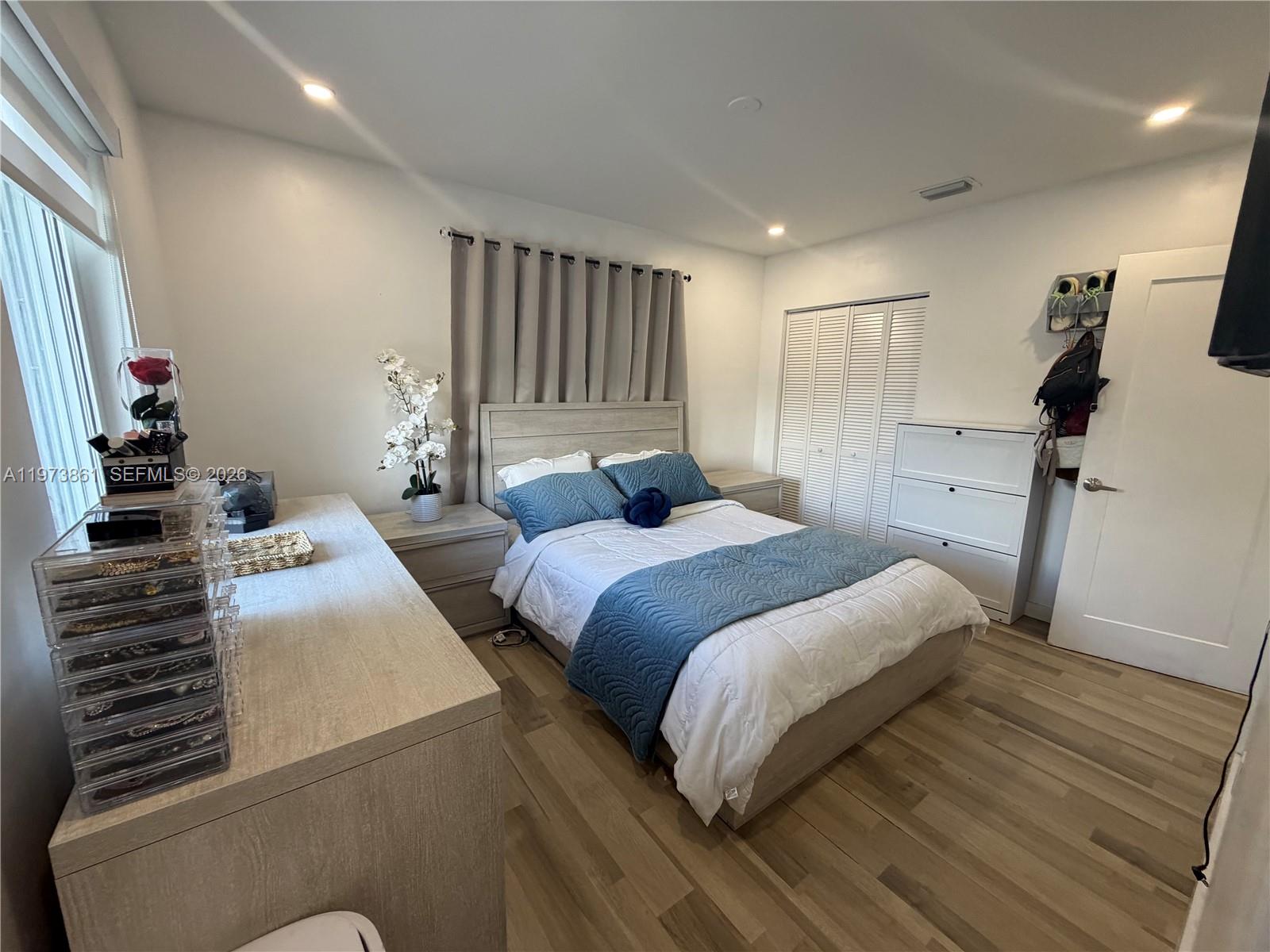 2401 Southwest 83rd Avenue Miami, FL 33155 - Photo 16 of 21 a bedroom with a bed and a large mirror