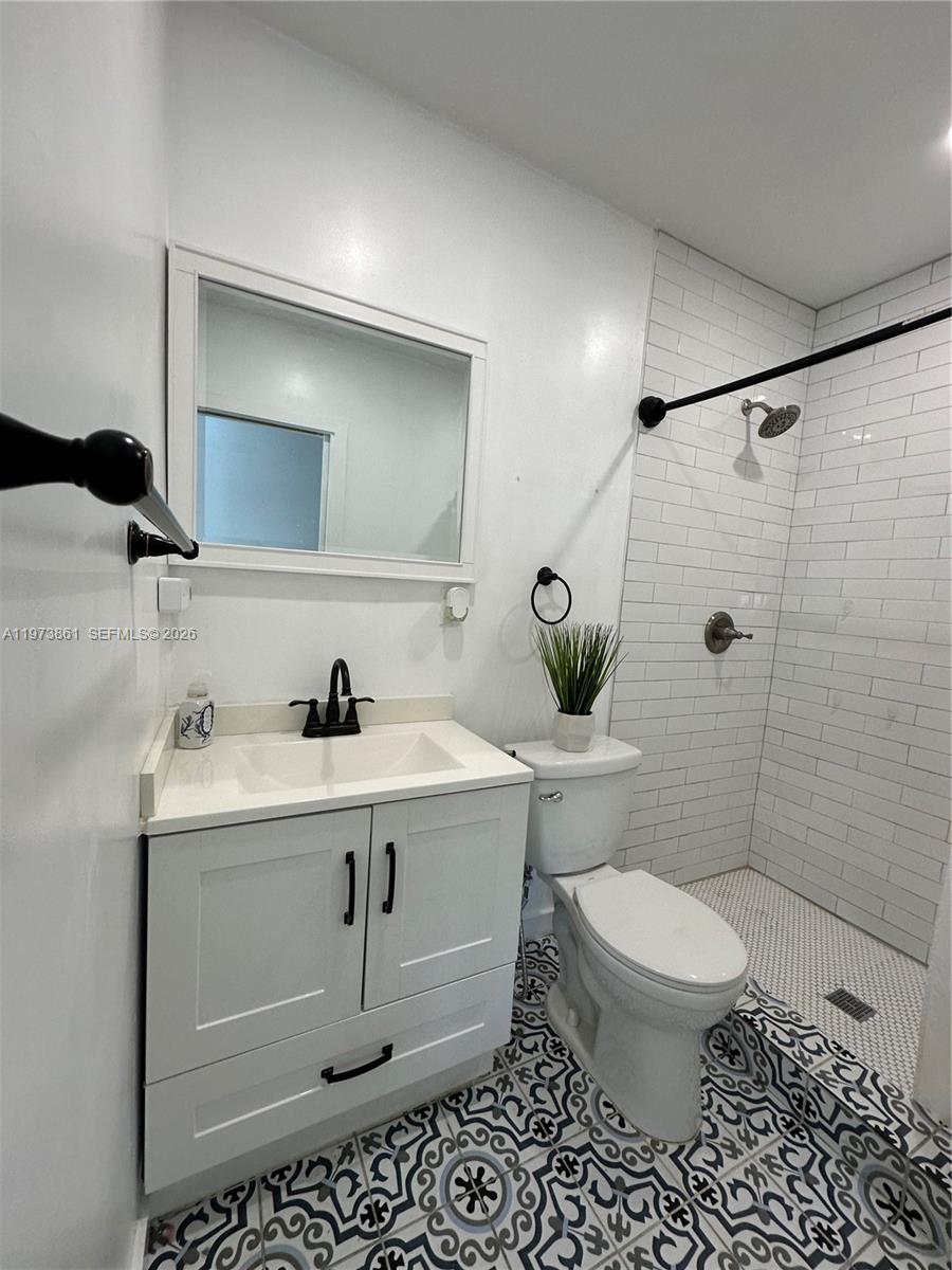 2401 Southwest 83rd Avenue Miami, FL 33155 - Photo 20 of 21 a bathroom with a sink a toilet and shower