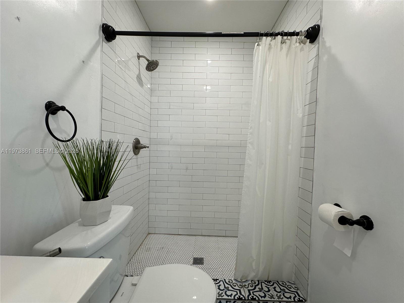 2401 Southwest 83rd Avenue Miami, FL 33155 - Photo 21 of 21 a bathroom with a shower a toilet and a shower