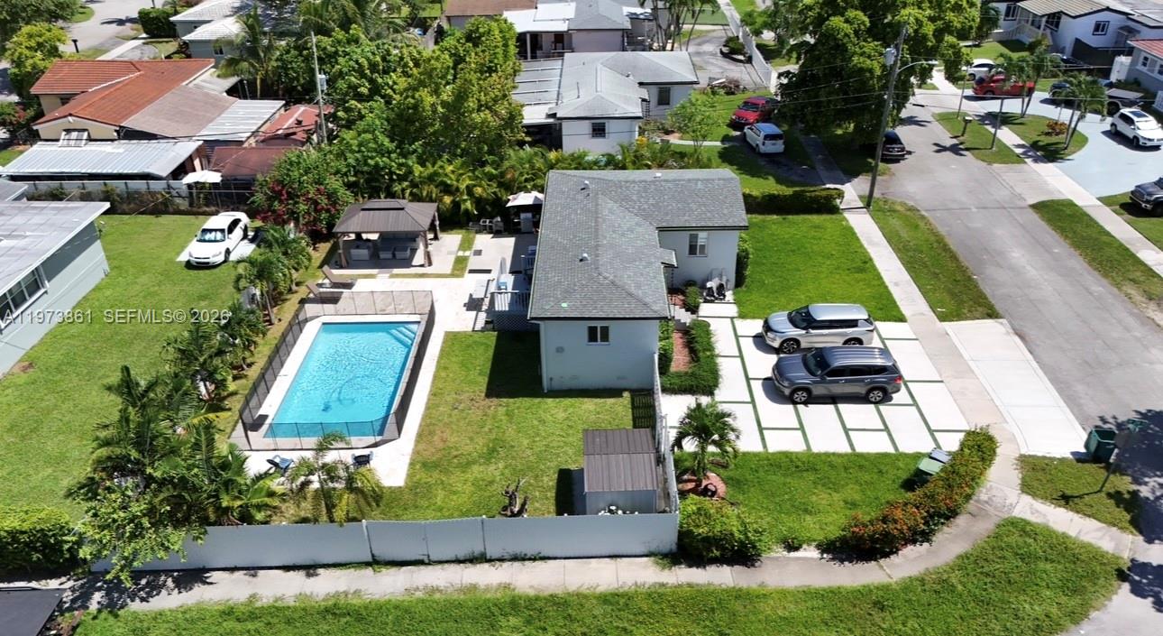 2401 Southwest 83rd Avenue Miami, FL 33155 - Photo 3 of 21 an aerial view of a house with a garden and swimming pool