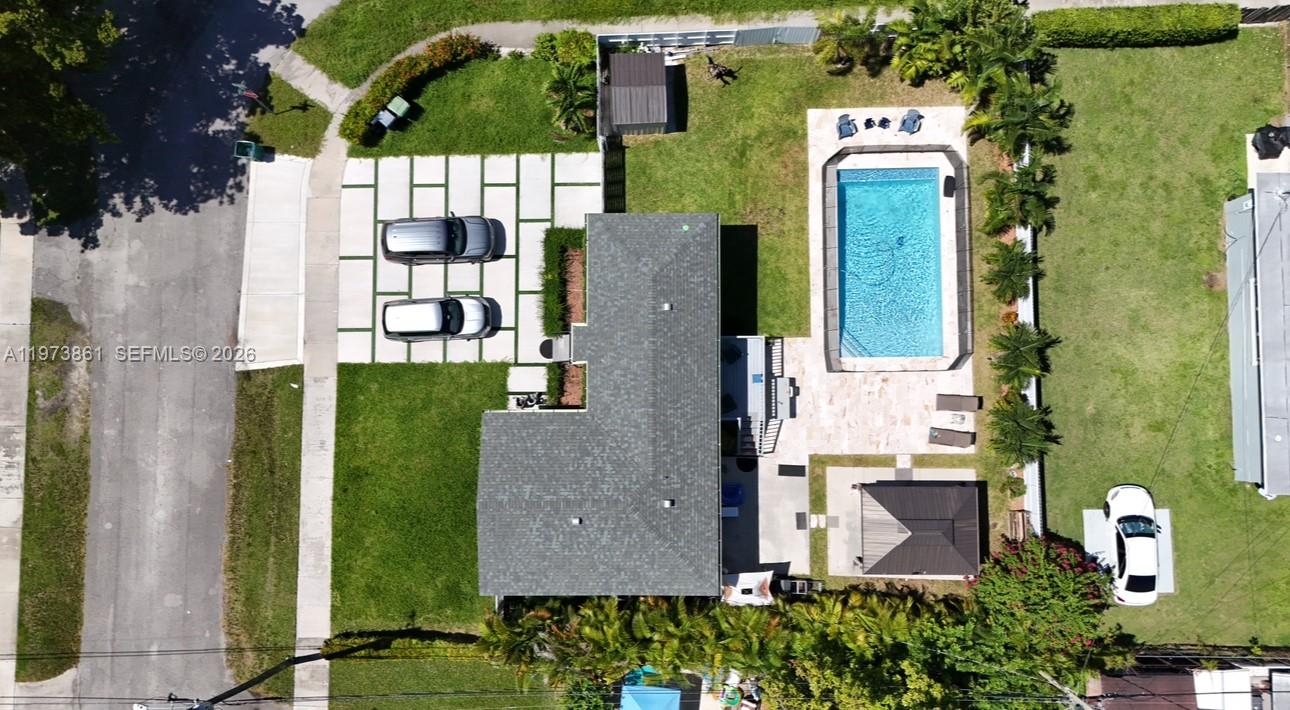 2401 Southwest 83rd Avenue Miami, FL 33155 - Photo 6 of 21 an aerial view of a house with a garden and trees