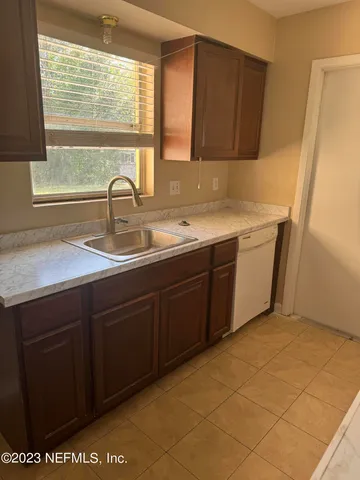 a kitchen with a sink and a window
