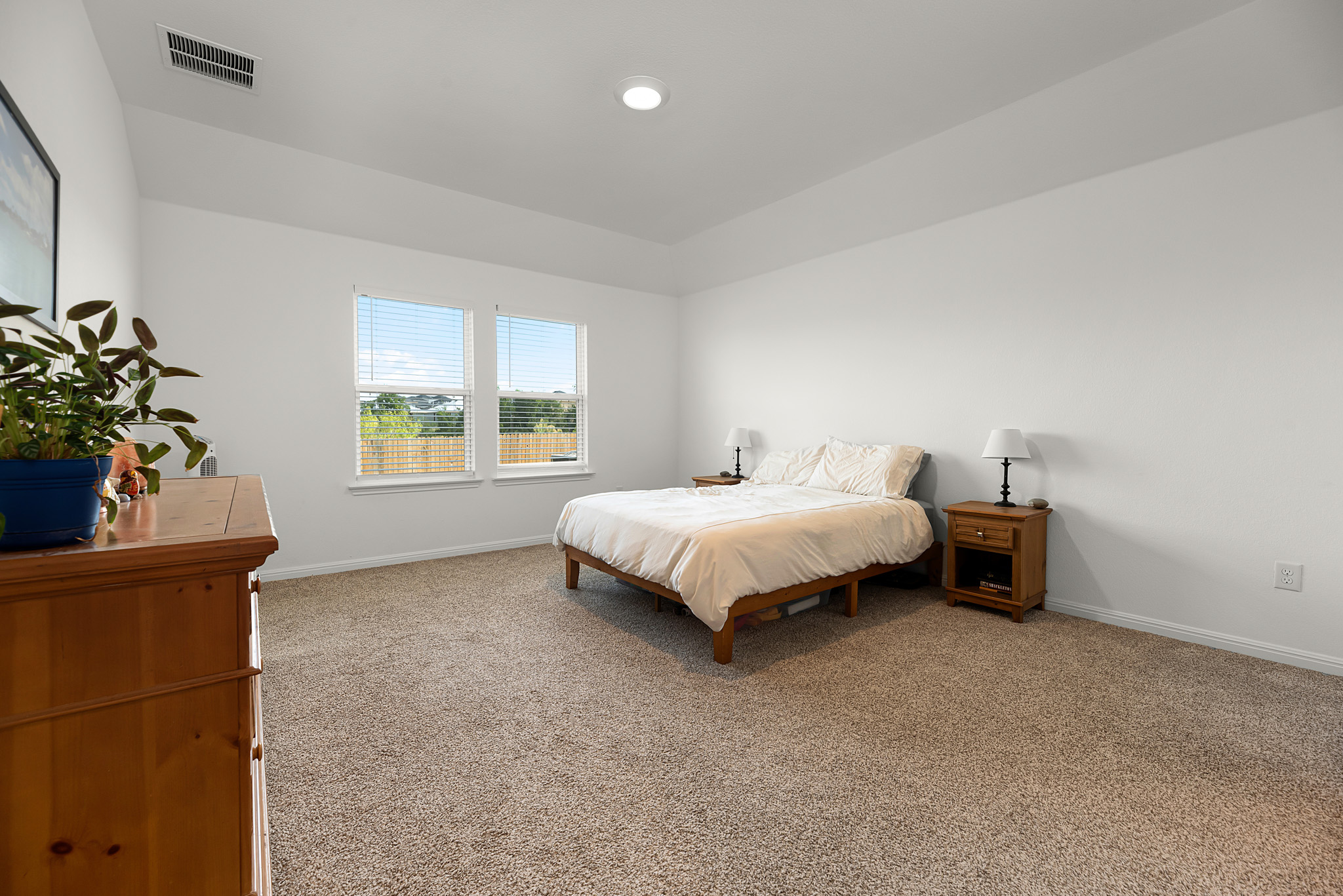 165 Santa Rosa Lane Buda, TX 78610 - Photo 10 of 21 a bedroom with a bed and a window
