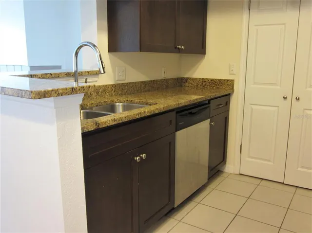 a kitchen with a sink and cabinets