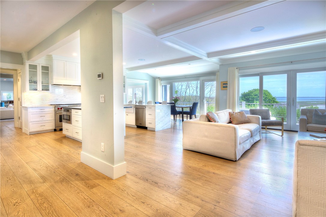 444 Purgatory Lane Middletown, RI 02842 - Photo 49 of 49 Walk to a wall of glass overlooking the water with open floor plan.