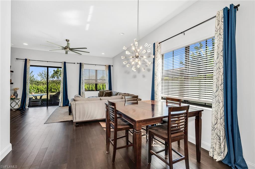 5344 Chandler Way Ave Maria, FL 34142 - Photo 13 of 47 a view of a dining room with furniture window and wooden floor