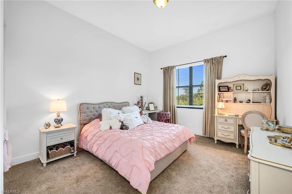5344 Chandler Way Ave Maria, FL 34142 - Photo 18 of 47 a bedroom with a bed and a window
