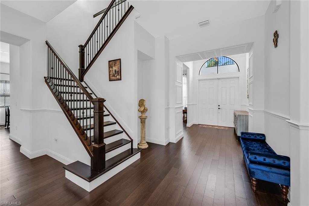 5344 Chandler Way Ave Maria, FL 34142 - Photo 21 of 47 a view of entryway with wooden floor and stairs