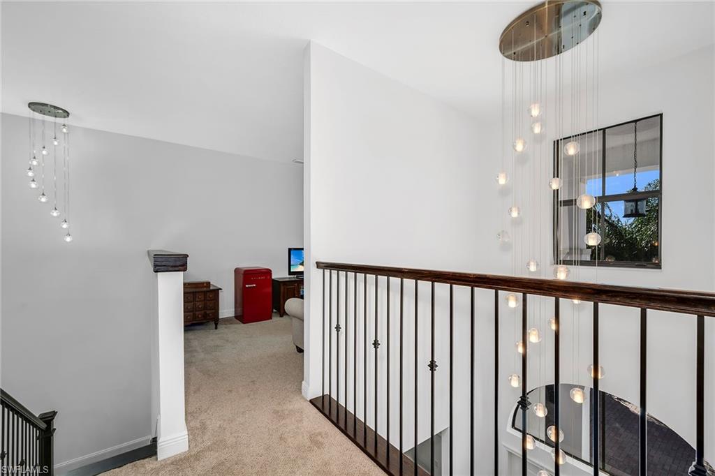 5344 Chandler Way Ave Maria, FL 34142 - Photo 22 of 47 a view of a hallway with seating area