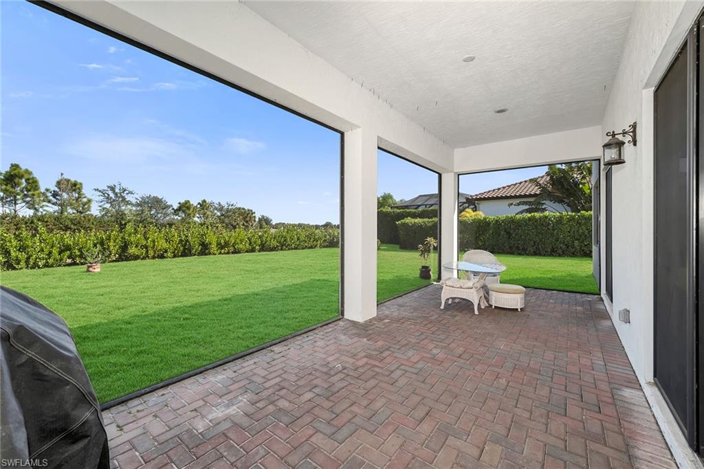 5344 Chandler Way Ave Maria, FL 34142 - Photo 38 of 47 a view of a patio with a yard