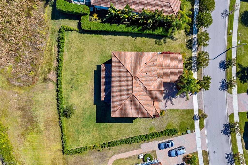 5344 Chandler Way Ave Maria, FL 34142 - Photo 40 of 47 an aerial view of a house with a lake view