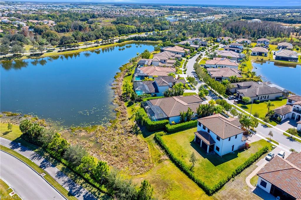 5344 Chandler Way Ave Maria, FL 34142 - Photo 43 of 47 an aerial view of residential houses with outdoor space